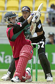 Zimbabwe's batsman Stuart Carlisle (left) and New Zealand's Adam Parore (right) in action during the second one day international in Wellington on Wednesday.