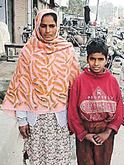 Free at last: Hussan Lal with his mother.