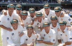 The Australian cricket team celebrate with the winners trophy after they won the fifth cricket Test match against West Indies at the Sydney, on Saturday. 