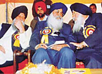The Finance Minister, Capt Kanwaljit Singh, and the Chief Minister, Mr Parkash Singh Badal, share views with Mr Charanjeet Singh Walia, president, PSSF, at a conference in Patiala.