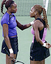 The USA Venus Williams (left) encourages her sister Serena