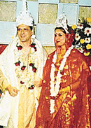 Pulitzer award winner Jhumpa Lahiri poses with her husband Alberto Vourvoulias during their marriage ceremony