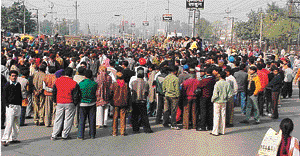 Residents of the Chowni Mohalla area block traffic on the GT Road  in Ludhiana on Wednesday.�