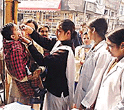A health worker administers polio drops to a child in Ludhiana on Sunday.
