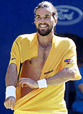 Australia�s Pat Rafter rips his shirt off as he celebrates his fourth round win over Great Britain�s Tim Henman at the Australian Open in Melbourne on Sunday. 
