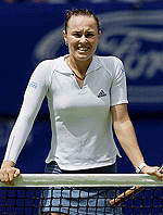 Martina Hingis leans on the net following her fourth round match against Italy's Rita Grande at the Australian Open in Melbourne.