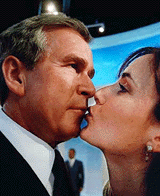 Stefani McMurrey of Dallas, Texas, kisses a wax statue of President George W.Bush