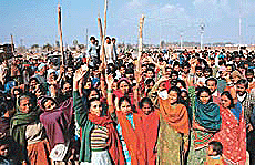 Agitated residents of Rajiv Colony in Sector 16, Panchkula, protest against demolition in the colony by HUDA.