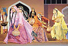 Folk dancers from Punjab perform at the Republic Day Folk Dance Festival, after it was inaugurated by President K. R. Narayanan at Talkatora Stadium in New Delhi on Wednesday.