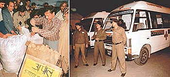 Members of the Sector 45 Market Association (Burail) pack relief material for Gujarat and (right) the police waits at the Air Force station for the quake victims to be transferred to hospitals in Chandigarh on Sunday.