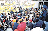 Mr Harminder Singh Gill, President, AISSF, addresses party workers who staged a dharna in Ludhiana on Tuesday.