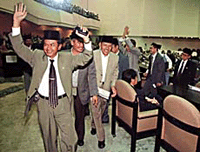 Members of Indonesian President Abdurrahman Wahid's party walk out from the meeting room during a debate on censuring the President at the Parliament building in Jakarta on Thursday.