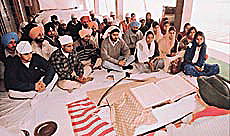 Students organise an akhand path as part of their endeavour to raise funds for the Gujarat quake-hit people, on the Panjab University campus in Chandigarh on Thursday.