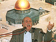 Ahmed Jibril, leader of the Popular Front for the Liberation of Palestine, speaks during a rally in Yarmouk camp near Damascus. 