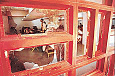 Window panes of the Panjab University Library, which were broken by hoolingans on Wednesday.