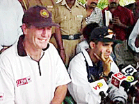 Indian cricket captain Saurav Ganguly is in a pensive mood as team coach John Wright drives home a point to mediamen at a press conference in Chennai on Thursday.