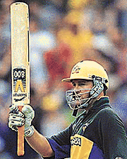 Mark Waugh of Australia raises his bat to the crowd after making the highest score by an Australian in a limited overs match during the second final of the one-day cricket series between the West Indies and Australia at the Melbourne Cricket Ground on Friday.