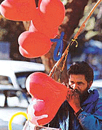 Hearts in demand: a balloon seller inflates a heart-shaped balloon in Chandigarh on Saturday as sale of such balloons picks up in view of Valentine�s Day.