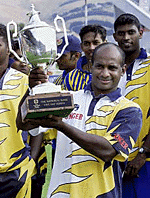 Sri Lanka captain Sanath Jayasuriya with the trophy his team won in the five-match one-day series