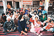 Councillors protest against the water and sewerage tariff hike in front of the civic body office in Phase VII, SAS Nagar, on Tuesday.
