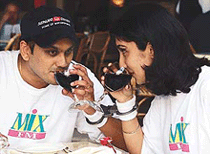 A Malaysian Valentine's Day couple, Baldeep Singh and his wife, Inderjit Kaur, drink after getting themselves handcuffed in Kaula Lumpur on Wednesday.