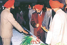 Dr Kirpal Singh Aulakh, Pro-VC, PAU, observes exhibits during the state-level horticultural officers workshop in Ludhiana on Thursday.