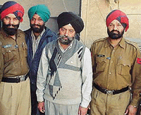 Murder accused Bhupinder Singh with the police.