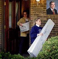 FBI agents carry out evidence, including two guns inside a box, from the home of FBI agent Robert Philip Hanssen (Inset) in Vienna, Virginia, on Tuesday.