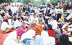 Leaders of various political parties sit on dharna outside the office of the Deputy Commissioner against the alleged murderer Gurmit Singh Pinki. 