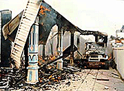 The car and residence of a Madurese family are engulfed in flames in the central Kalimantan city of Sampit as clashes erupted between Dayak tribesmen and Madurese settlers in the riot-torn town of Sampit. 