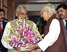 Prime Minister Atal Behari Vajpayee presents a bouquet to Vice-President Krishan Kant on his 75th birthday at his residence in New Delhi on Wednesday.