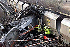 Emergency rescue workers attend the scene of two trains which collided in the northern England after a vehicle veered off the M62-motorway on to the railway track on Wednesday. 