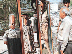 Realistic illusions: Nek Chand looks at his distorted image in a laughing glass put up in Rock Garden, Chandigarh, on Thursday.