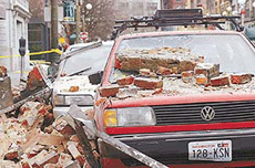 Bricks that fell from an earthquake cover parked cars in Seattle�s Pioneer Square district on Wednesday in Seattle.