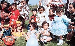 WINNERS ALL: Baby show contestants wait for their turn at the Spring Fest in Town Park, Panchkula, on Sunday.