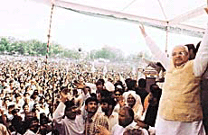 Mr Bhajan Lal waves to the crowd at the Haryana Bachao Rally in Bhiwani on Sunday.