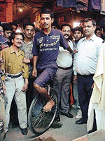 Subrato Chakraborty on his monocycle in Chaura Bazar, Ludhiana.