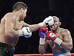 John Ruiz of Chelsea, Mass (left) lands a left to the face of opponent Evander Holyfield, of Atlanta, Ga., in the 11th round of their WBA heavyweight championship fight in Las Vegas on Saturday. 