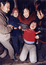 Chinese mourn the death of their loved ones after an explosion of fireworks caused by the collapse of a primary school at Fanglin village in the eastern province of Jiangxi on Tuesday. 