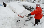Residents of the northern Boston suburb of Andover, Massachusetts, shovel out their cars after a major winter storm dumped three feet of snow on Merrimack valley on Tuesday