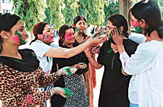Holi revellers in action at Government College for Girls.