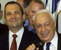 Outgoing Israeli Prime Minister Ehud Barak (left) listens to his successor, Ariel Sharon, during a handover ceremony at the Prime Minister�s office in Jerusalem on Thursday. 