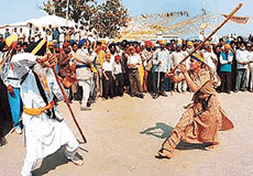 Sher-e-Punjab gatka party performs during the Hola Mohalla procession at Anandpur Sahib on Saturday.
