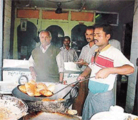 A halwai makes poori-kachauri at a restaurant in Ludhiana.