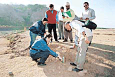 Russian geologist Dr Alexander Strom examines the crack that appeared at Nada, in Panchkula on Saturday. 