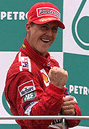 Michael Schumacher celebrates after winning 