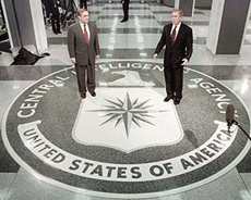 U.S. President George W. Bush (right) answers reporters� questions about Macedonia with CIA Director George J. Tenet after speaking to CIA employees at Langley, Virginia, on Tuesday.