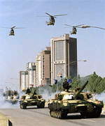 Puma helicopters fly over Russia-made T-18 tanks during a Pakistan national day parade which was addressed by President Mohammad Rafiq Tarar in Islamabad on Friday.
