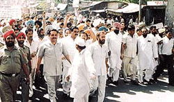 Congress activists take out a procession in Ludhiana on Sunday.