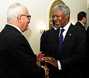 UN Secretary-General Kofi Annan greets Iraqi Deputy Prime Minister Tarek Aziz in Amman on Tuesday.